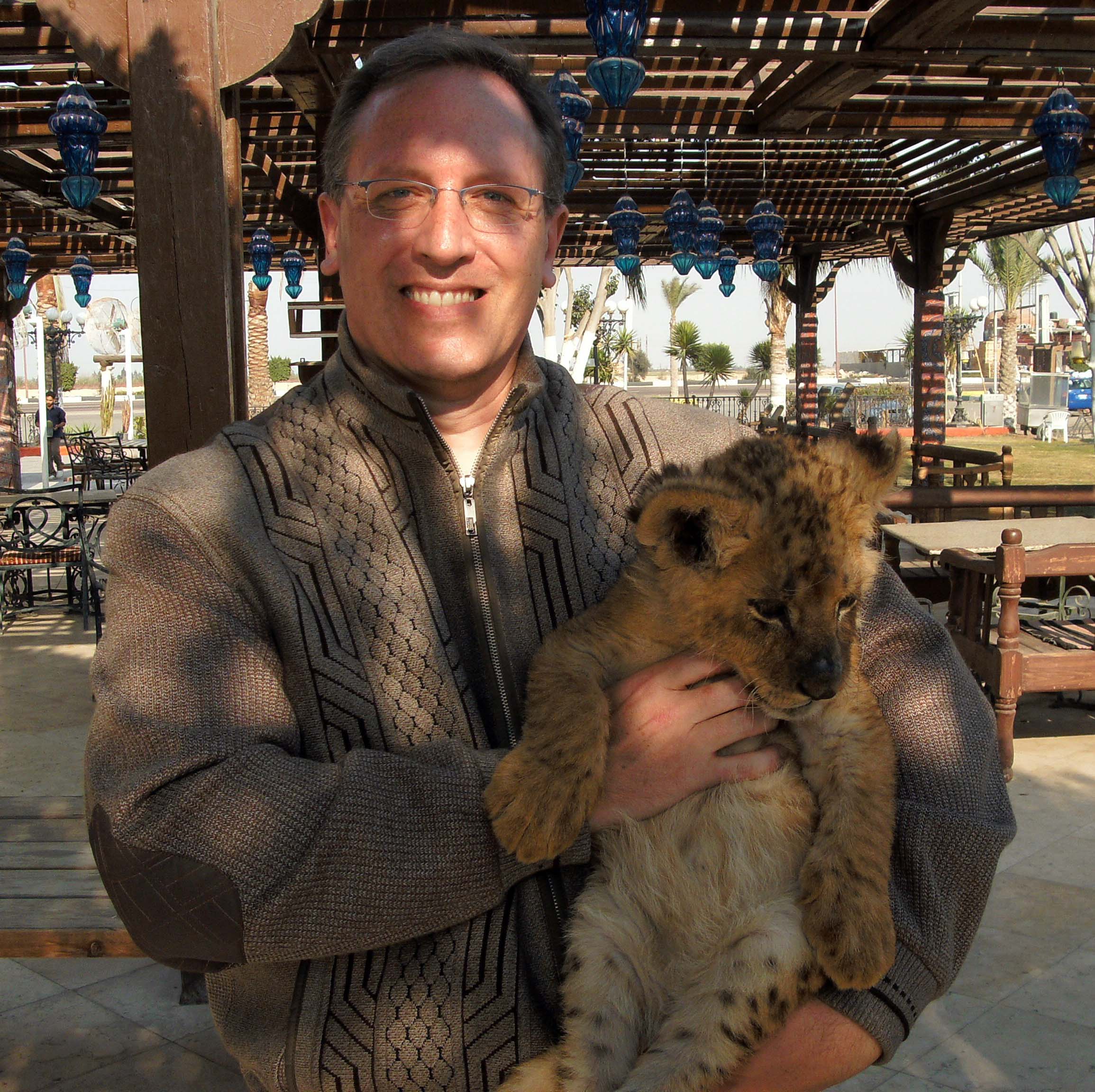 Craig Henderson with lion cub